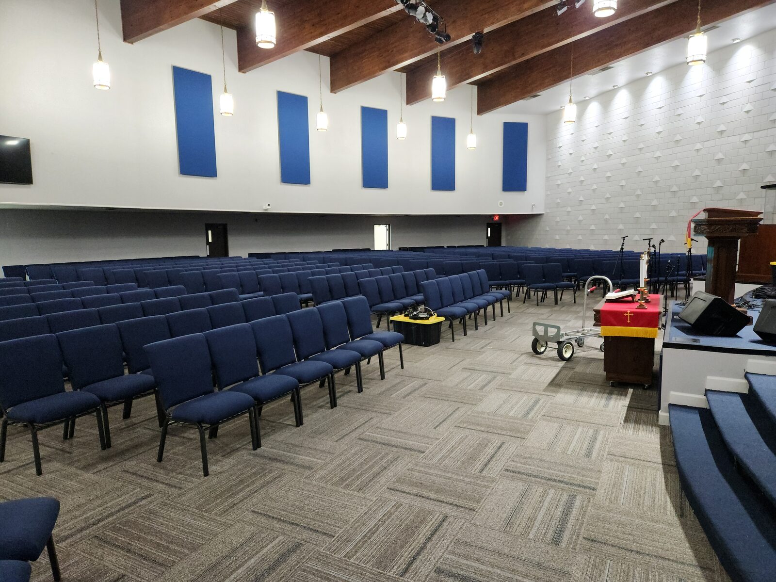 Mt. Gilead finished sanctuary with carpet tile flooring and blue seating Nashville